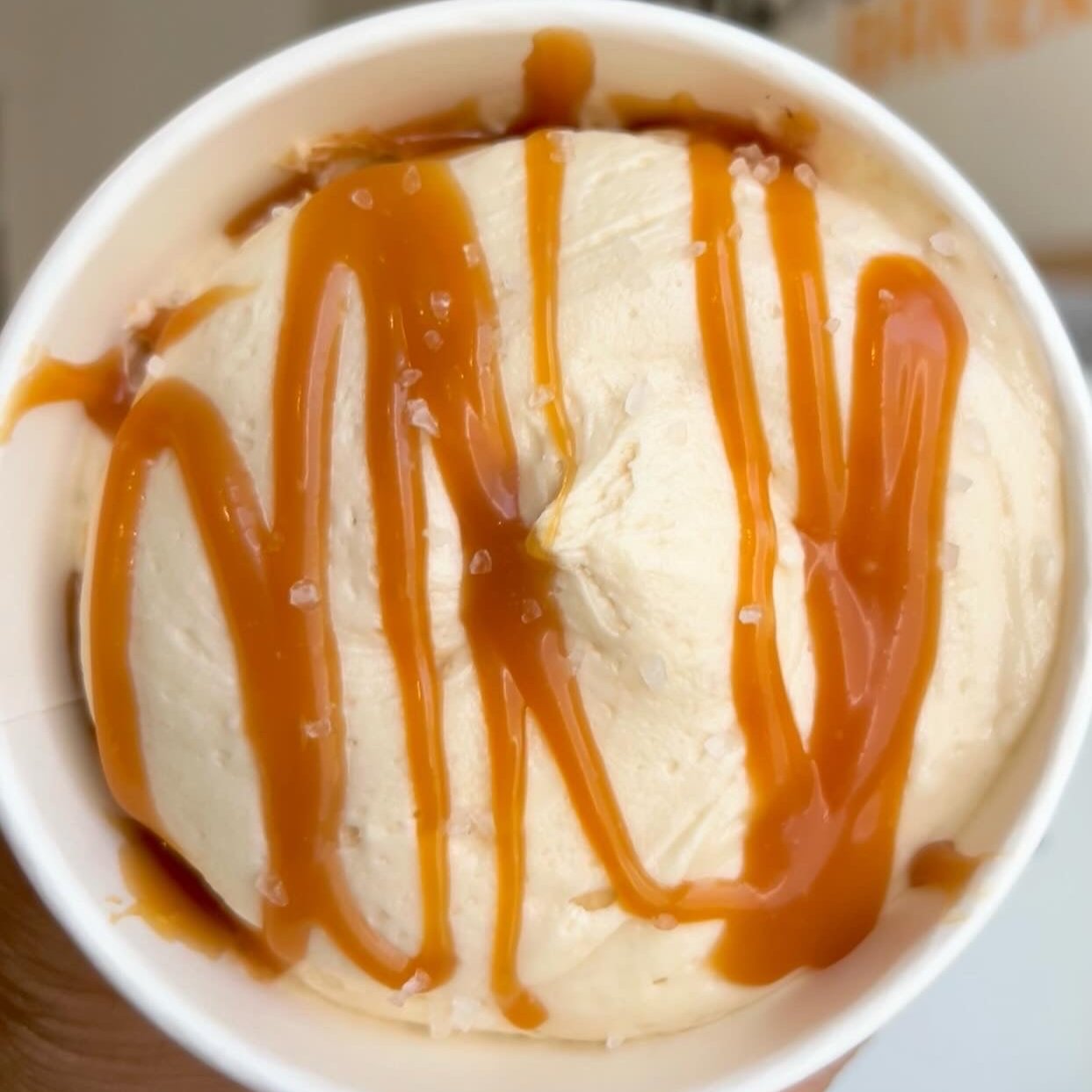 Cup of Cake with Caramel Drizzle on caramel frosting