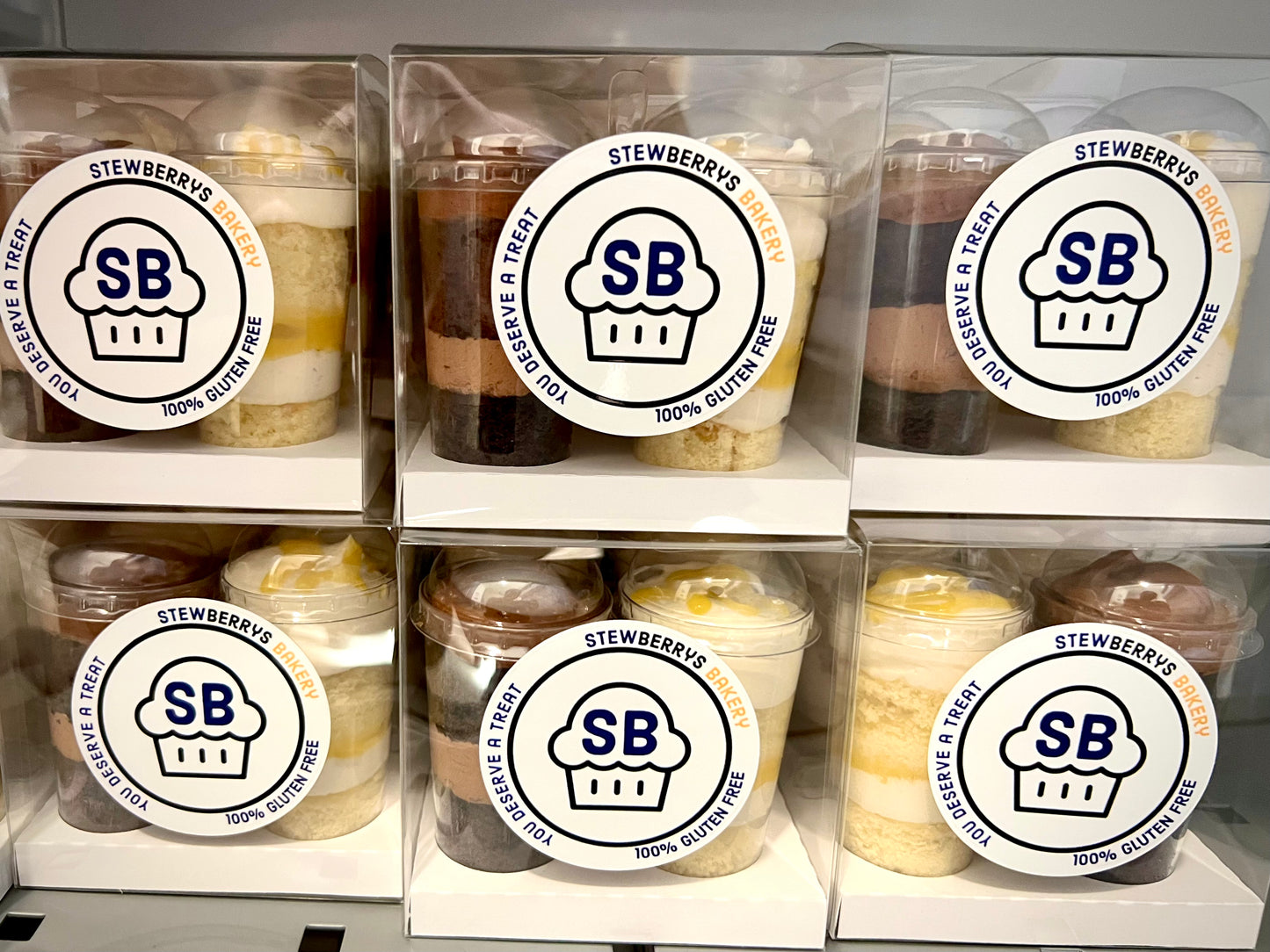 Four Mini Cakes by the cup individually packed in clear boxes